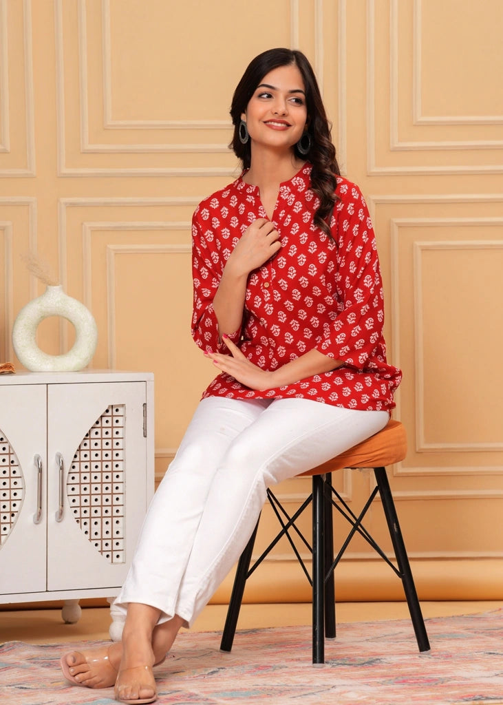 Red printed cotton straight tunic top for women with three-quarter sleeves, featuring breathable fabric and a flattering silhouette perfect for casual, work, or semi-formal wear.