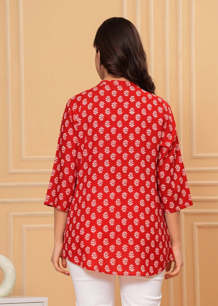 Red printed cotton straight tunic top for women with three-quarter sleeves, featuring breathable fabric and a flattering silhouette perfect for casual, work, or semi-formal wear.