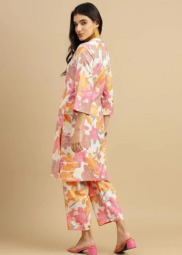 Women's pink cotton kurti and pant set with embroidered detailing and three-quarter sleeves