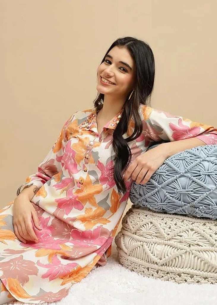 Women's pink cotton kurti and pant set with embroidered detailing and three-quarter sleeves