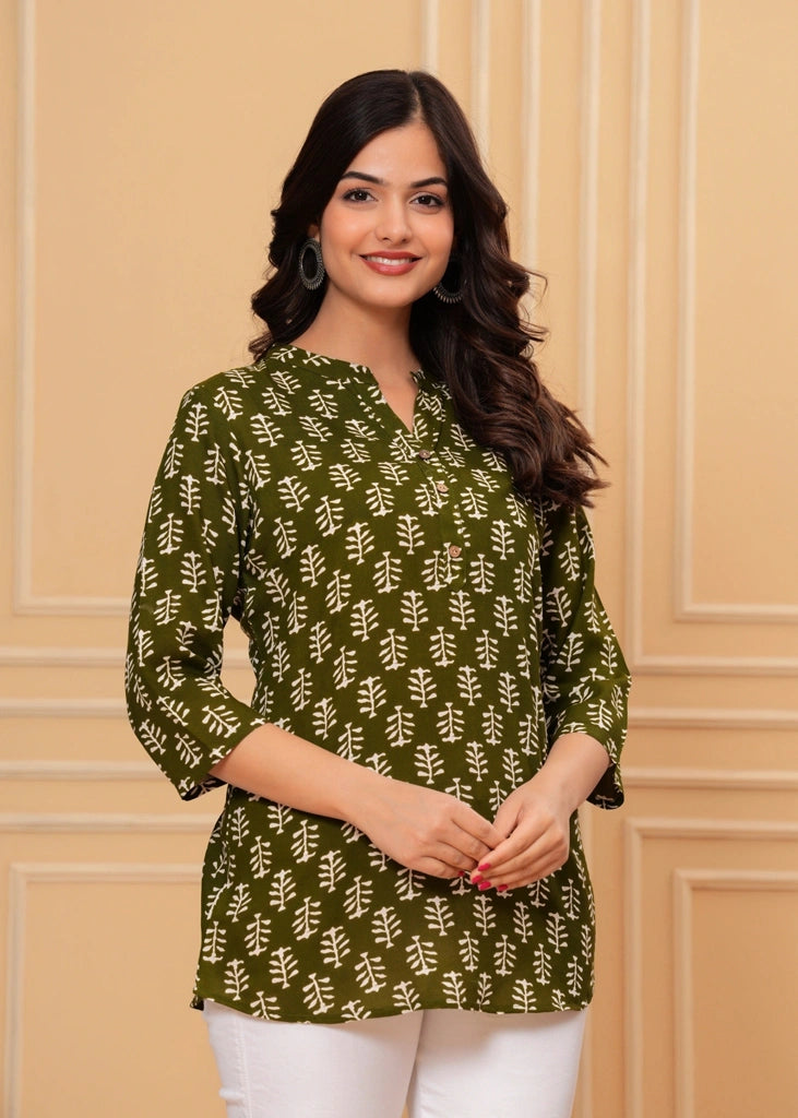 Green cotton straight tunic top for women with three-quarter sleeves, designed for breathable comfort and a flattering silhouette ideal for work or casual wear.