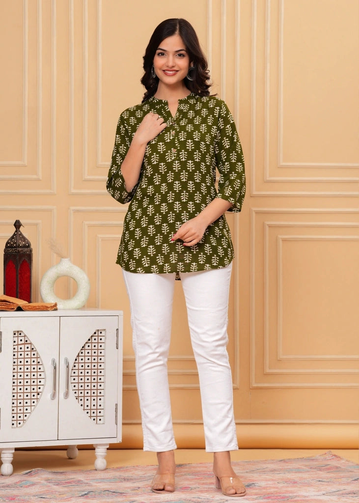 Green cotton straight tunic top for women with three-quarter sleeves, designed for breathable comfort and a flattering silhouette ideal for work or casual wear.