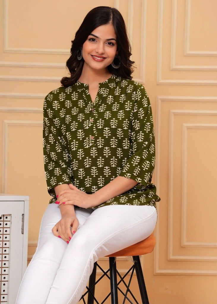 Green cotton straight tunic top for women with three-quarter sleeves, designed for breathable comfort and a flattering silhouette ideal for work or casual wear.
