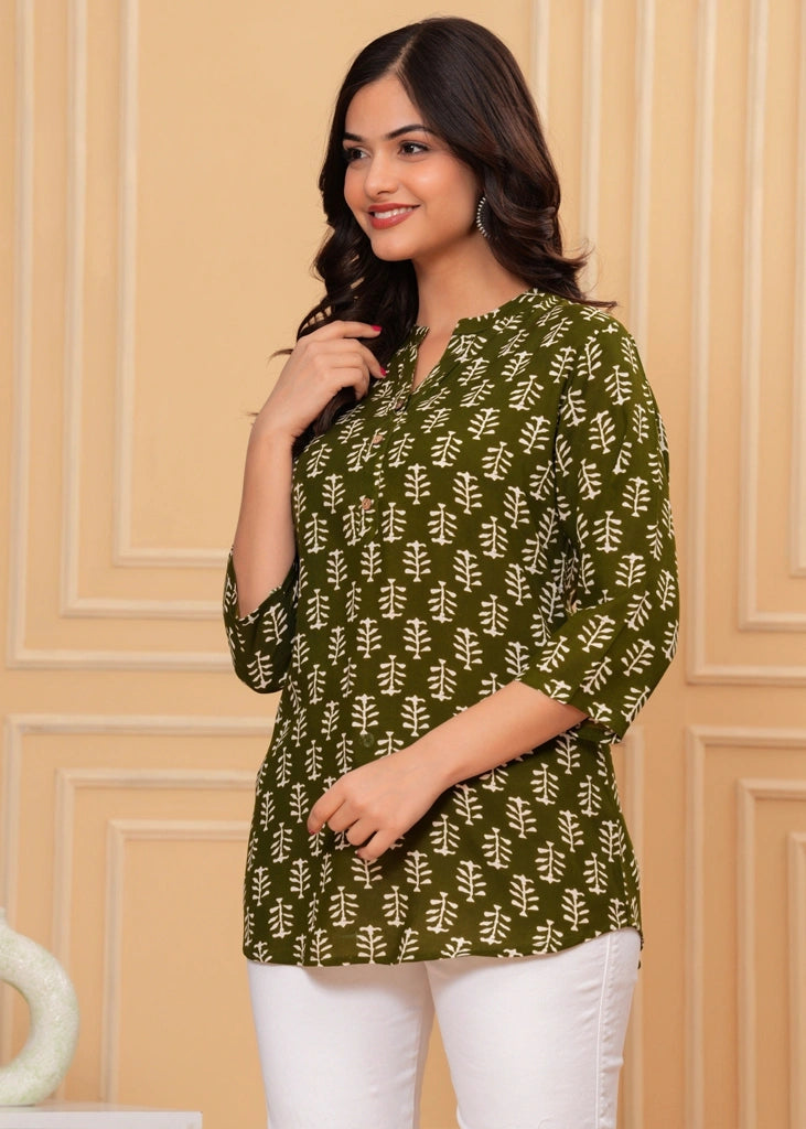Green cotton straight tunic top for women with three-quarter sleeves, designed for breathable comfort and a flattering silhouette ideal for work or casual wear.