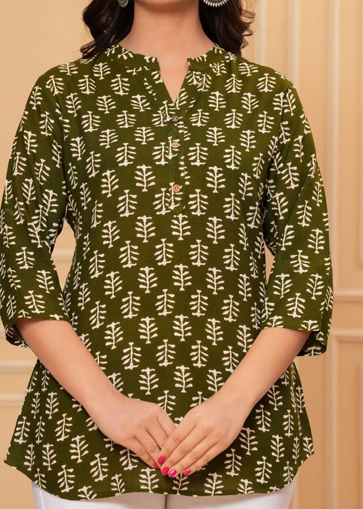 Green cotton straight tunic top for women with three-quarter sleeves, designed for breathable comfort and a flattering silhouette ideal for work or casual wear.