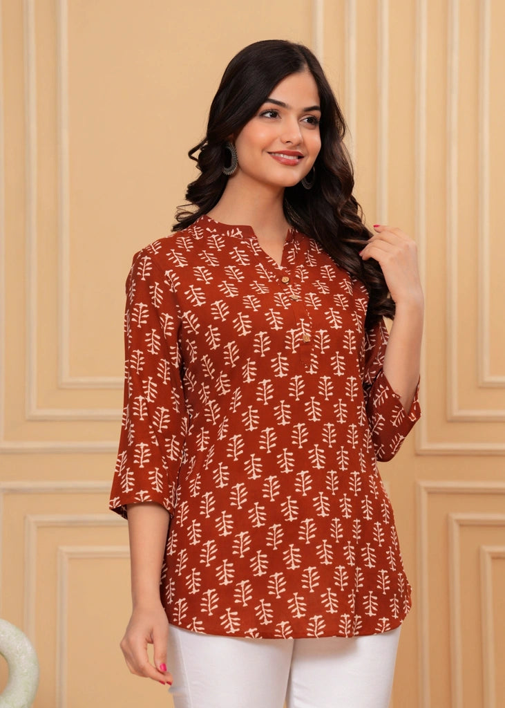 Maroon cotton straight tunic top for women with three-quarter sleeves, offering a breathable fabric and sleek silhouette ideal for work, casual outings, or semi-formal wear.
