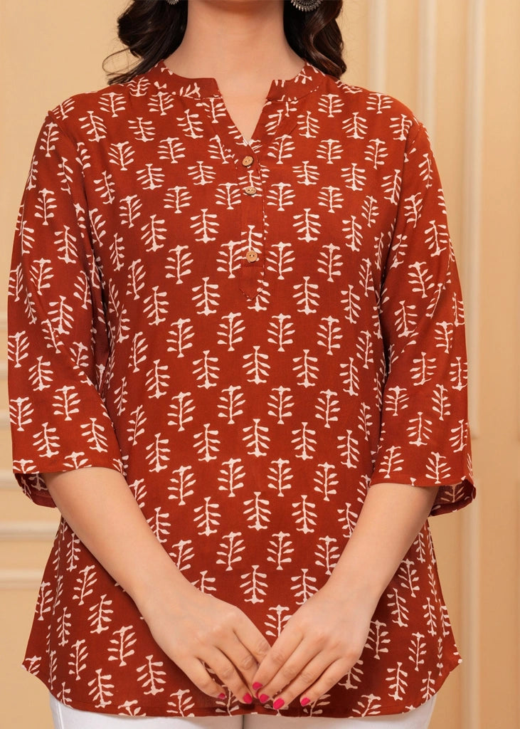 Maroon cotton straight tunic top for women with three-quarter sleeves, offering a breathable fabric and sleek silhouette ideal for work, casual outings, or semi-formal wear.